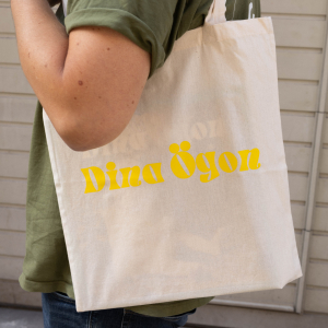 Dina Ögon - Totebag - Natural with yellow Logo in the group MERCHANDISE / Merch / RnB-Soul at Bengans Skivbutik AB (4410138)